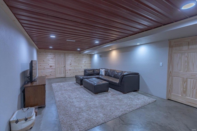 living room with concrete floors and wooden ceiling