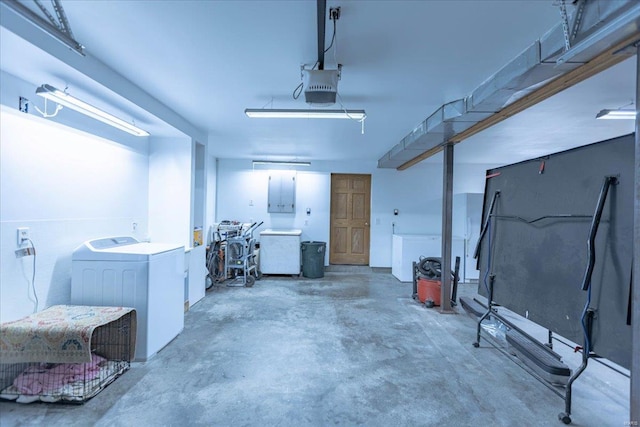 garage with washer / dryer and a garage door opener