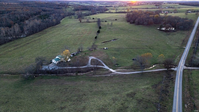 birds eye view of property featuring a rural view