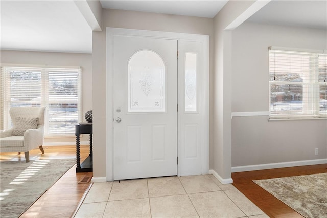 foyer featuring light tile patterned flooring