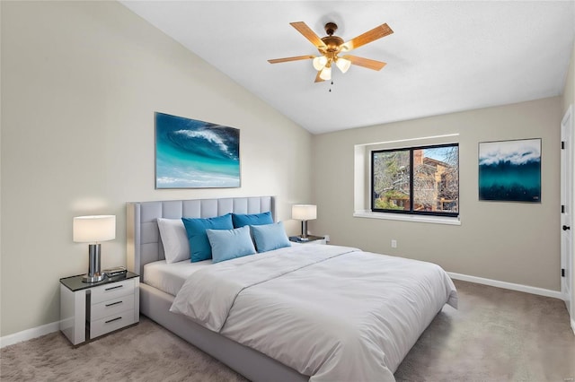 bedroom featuring light carpet, vaulted ceiling, and ceiling fan