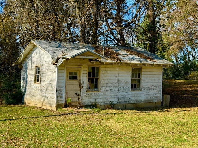 exterior space with a yard and an outdoor structure