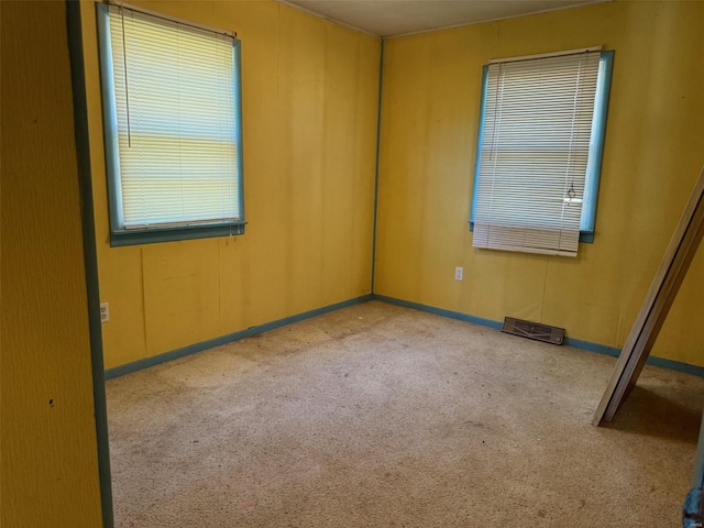 empty room featuring carpet flooring