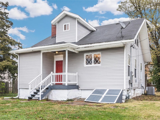 view of front facade featuring central AC unit and solar panels