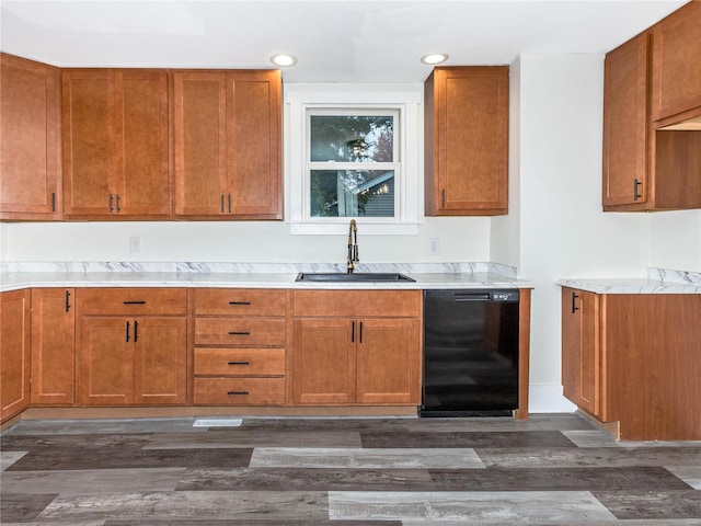 kitchen featuring black dishwasher, dark wood-type flooring, and sink