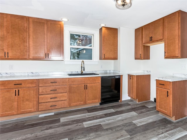 kitchen with dark hardwood / wood-style flooring, sink, and black dishwasher