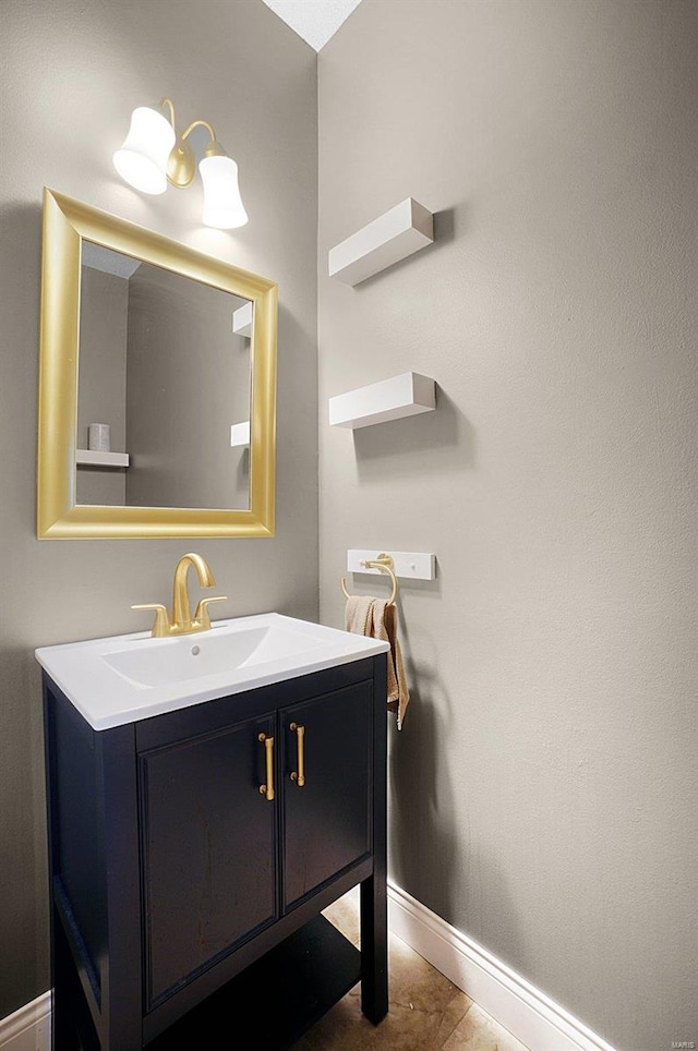 bathroom featuring tile patterned flooring and vanity