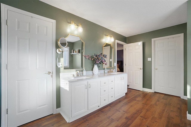 bathroom featuring vanity and wood-type flooring