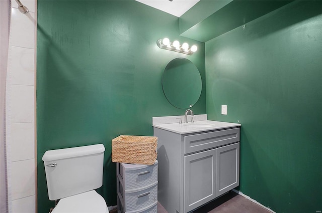 bathroom featuring vanity and toilet