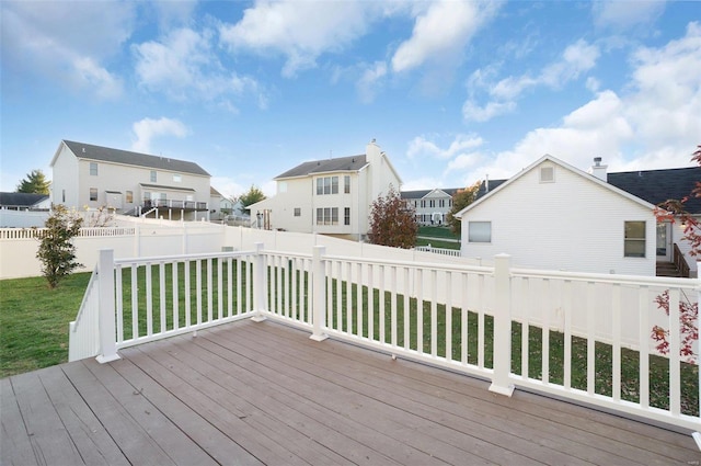 wooden deck with a lawn