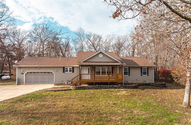 single story home with a porch, a garage, and a front lawn