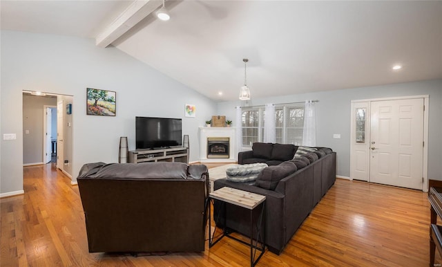 living room featuring hardwood / wood-style flooring and lofted ceiling with beams