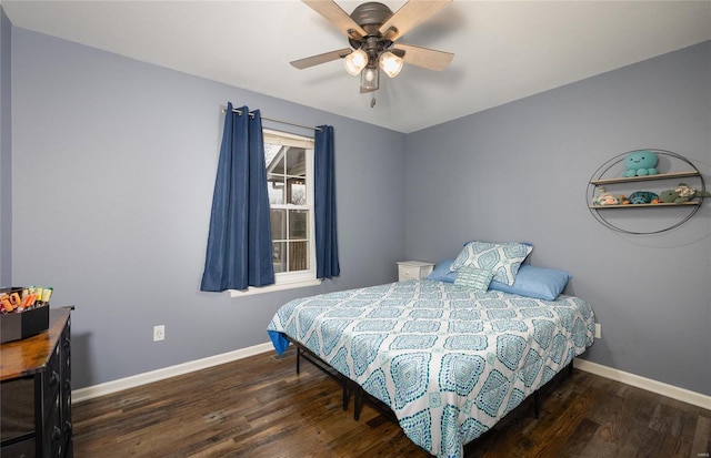 bedroom with ceiling fan and dark wood-type flooring