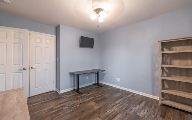 unfurnished bedroom featuring dark hardwood / wood-style flooring