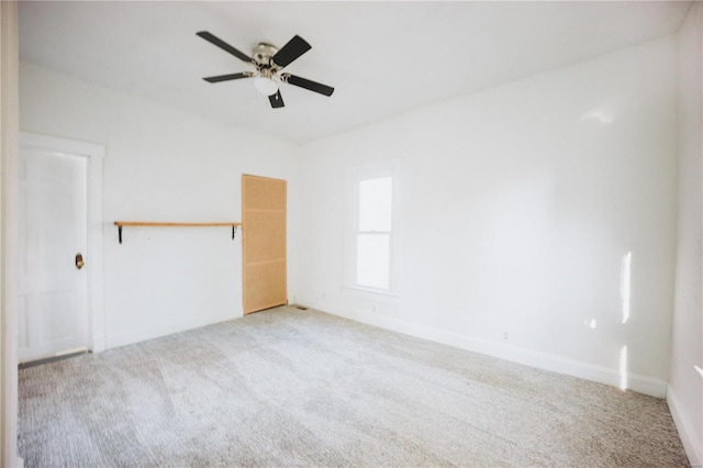 carpeted empty room with ceiling fan