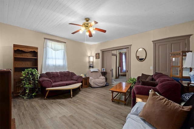 living room featuring ceiling fan and light wood-type flooring