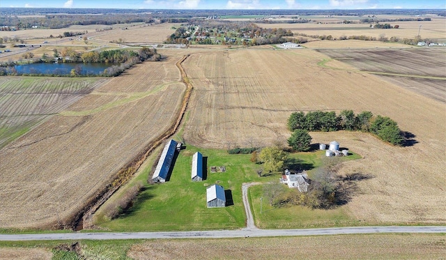 aerial view with a rural view and a water view