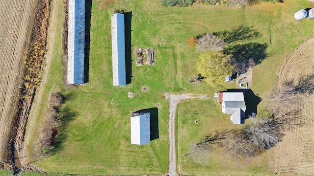 birds eye view of property with a rural view