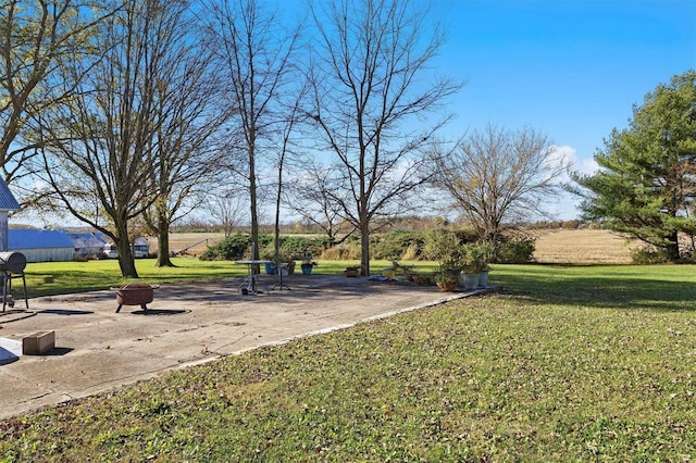 view of yard with an outdoor fire pit