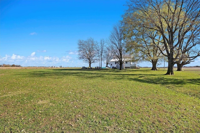 view of yard with a rural view