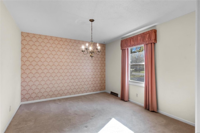 unfurnished dining area featuring a chandelier and carpet