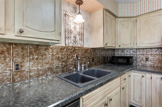 kitchen with decorative backsplash, light brown cabinetry, decorative light fixtures, and sink