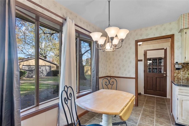 dining space featuring an inviting chandelier