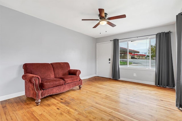 sitting room featuring ceiling fan and light wood-type flooring