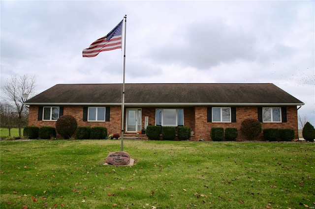 single story home with a front yard