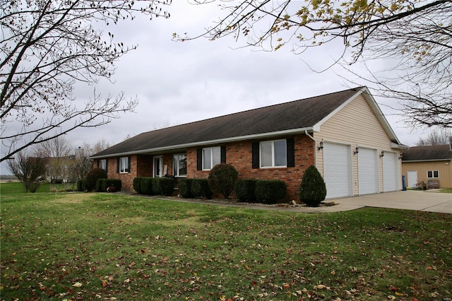 ranch-style home with a garage and a front lawn