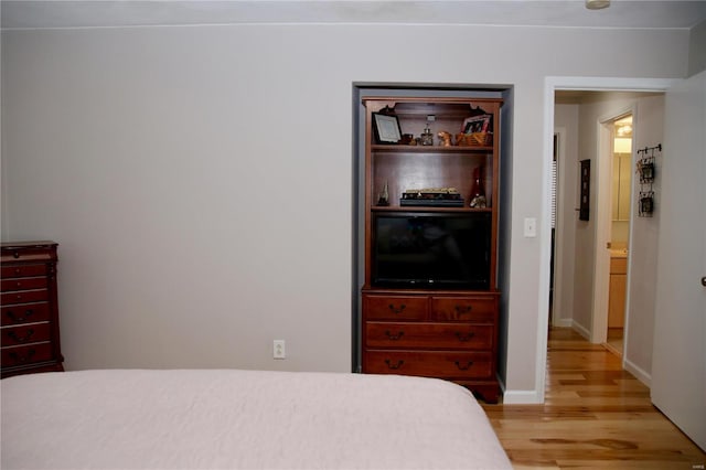 bedroom with light hardwood / wood-style floors