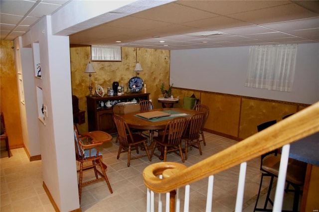 dining space featuring a paneled ceiling