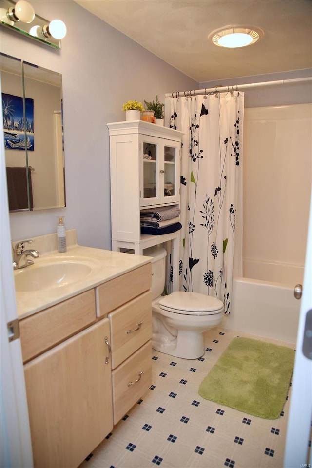 full bathroom featuring shower / bath combo, toilet, and vanity