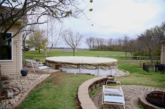 view of yard with a patio area and a covered pool