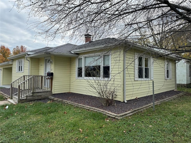 exterior space featuring a front lawn