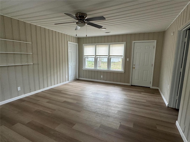 spare room with hardwood / wood-style flooring and ceiling fan