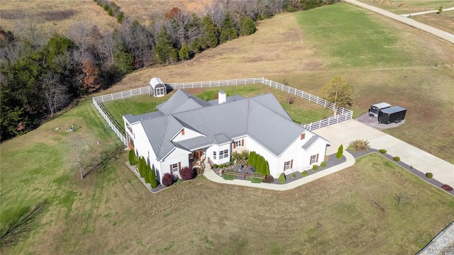 birds eye view of property with a rural view