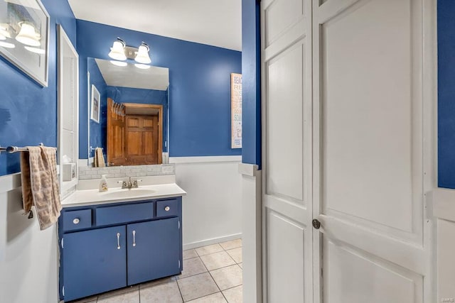 bathroom with backsplash, vanity, and tile patterned floors