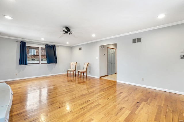 spare room featuring light wood-style floors, baseboards, visible vents, and recessed lighting