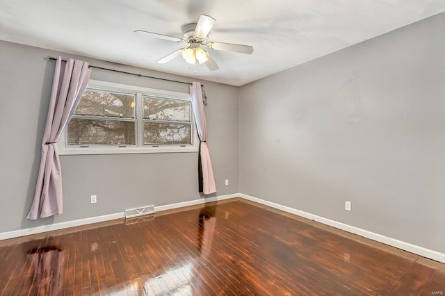 unfurnished room featuring visible vents, ceiling fan, hardwood / wood-style flooring, and baseboards