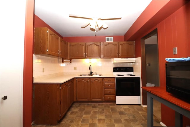 kitchen featuring backsplash, white electric stove, ceiling fan, and sink