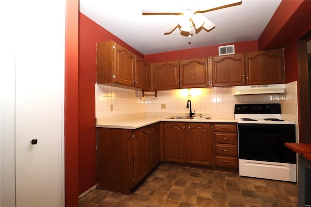 kitchen featuring white range with electric cooktop, ceiling fan, sink, and tasteful backsplash