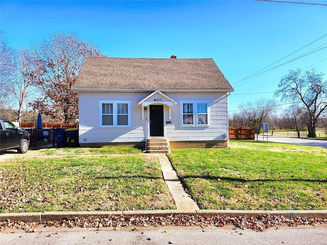 bungalow with a front yard