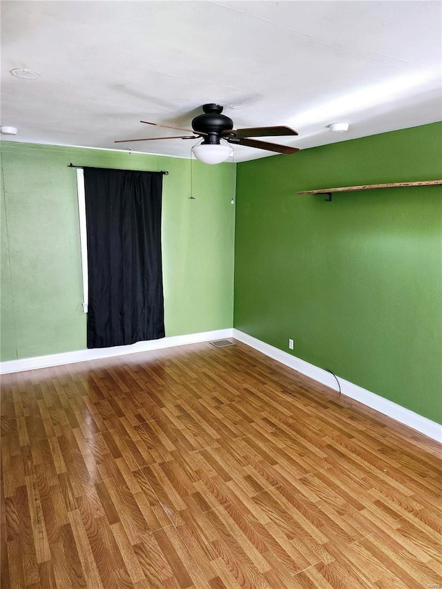 unfurnished room featuring hardwood / wood-style floors