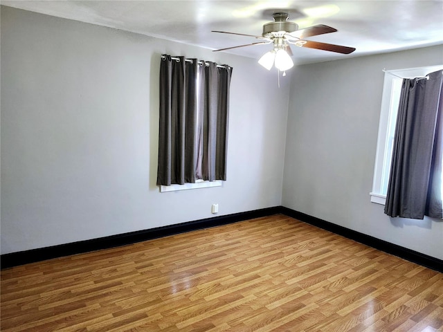 spare room featuring ceiling fan and light wood-type flooring