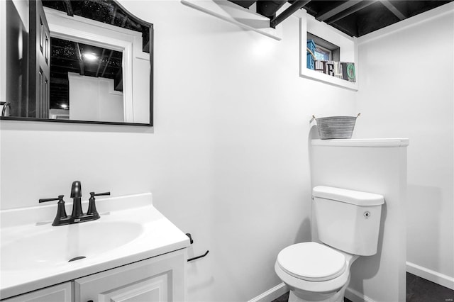 bathroom featuring vanity and toilet