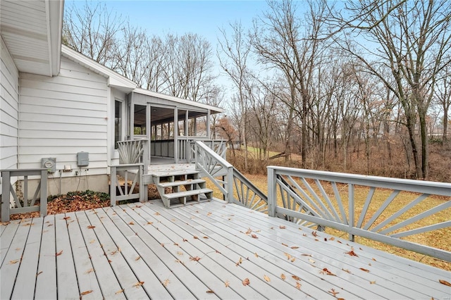 wooden terrace featuring a sunroom