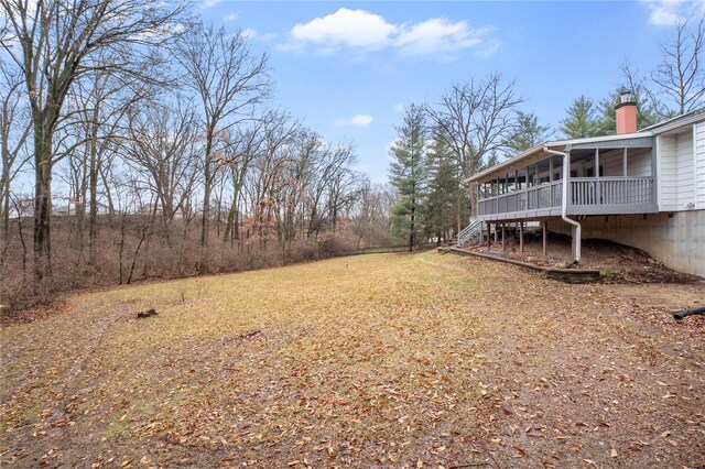 view of yard featuring a sunroom