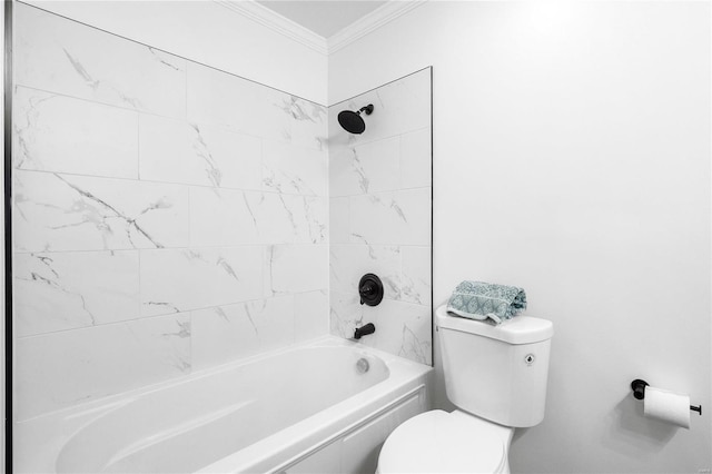 bathroom featuring tiled shower / bath combo, toilet, and ornamental molding