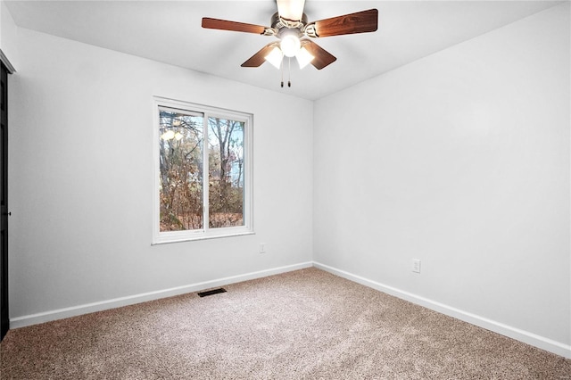 unfurnished room with carpet and ceiling fan